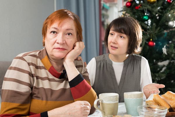 Quarrel of mother and daughter at the Christmas table