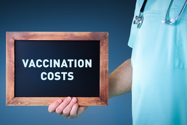 Vaccination costs. Doctor shows sign/board with wooden frame. Ba