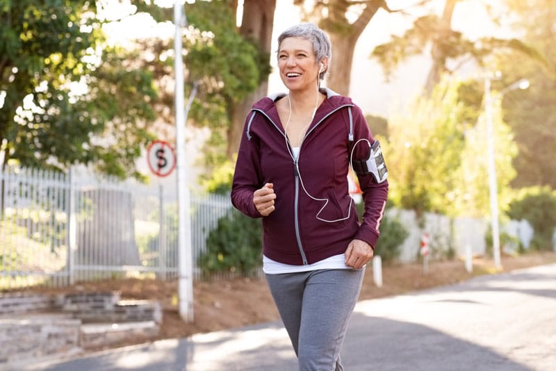 active senior woman jogging