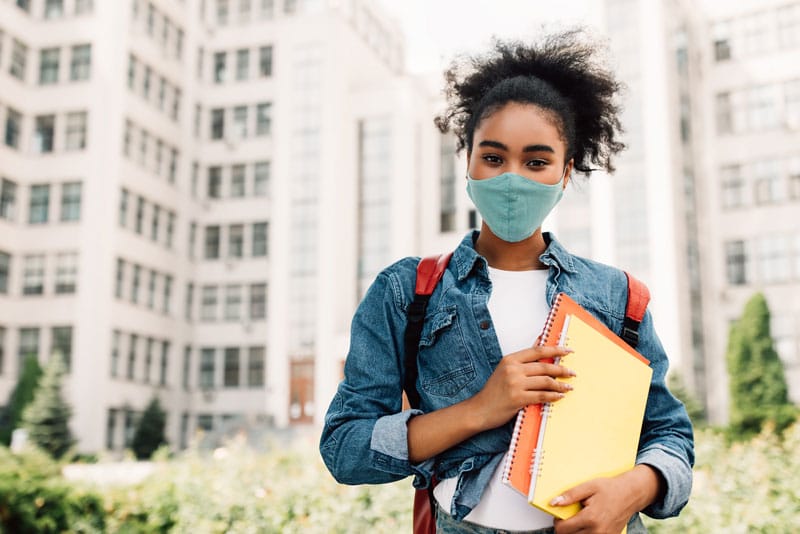 african american student girl wearing face mask