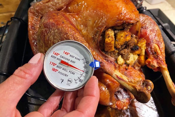 checking the temperature of the turkey