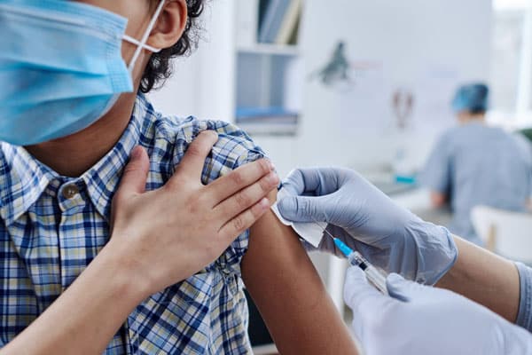 child gettinchild getting vaccine from covidg vaccine from-covid child getting vaccine from covid