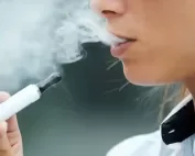 closeup of woman smoking electronic cigarette