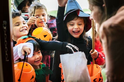 little children trick-or-treating on halloween