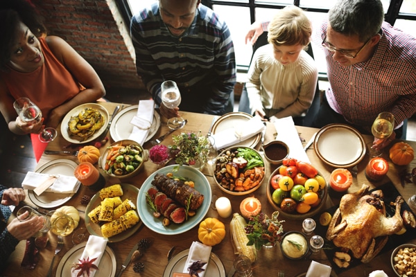 People Celebrating Thanksgiving Holiday Tradition Concept