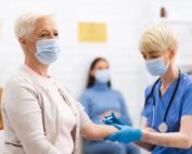 woman receiving covid-19 vaccine injection